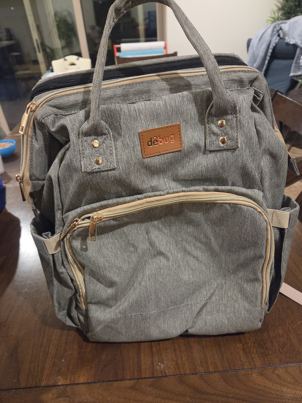 Amazon Gray Backpack with Gold Accents